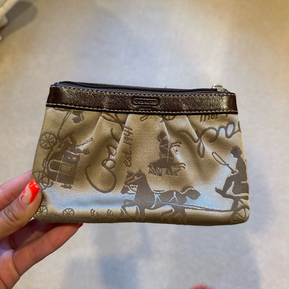 tan and brown coach wristlet